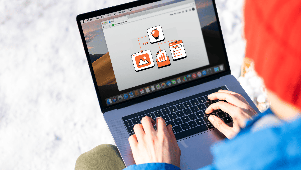 Person using a laptop with a workflow diagram on its screen