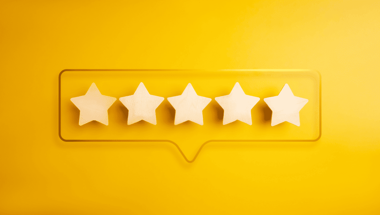 Five white stars inside a review speech bubble on a bright yellow background